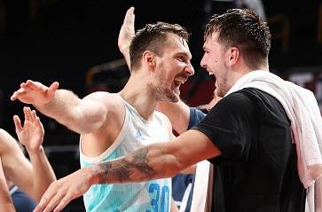 SAITAMA, JAPAN - AUGUST 03: Zoran Dragic #30 of Team Slovenia celebrates with Luka Doncic #77 during the second half of a Men's Basketball Quarterfinal game on day eleven of the Tokyo 2020 Olympic Games at Saitama Super Arena on August 03, 2021 in Saitama, Japan. (Photo by Gregory Shamus/Getty Images)